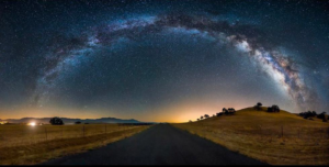 Cosmology - a view of the sky at night with a halo of stars